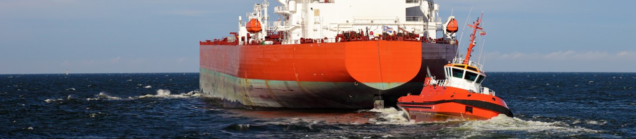 Escorting tanker by red tugs